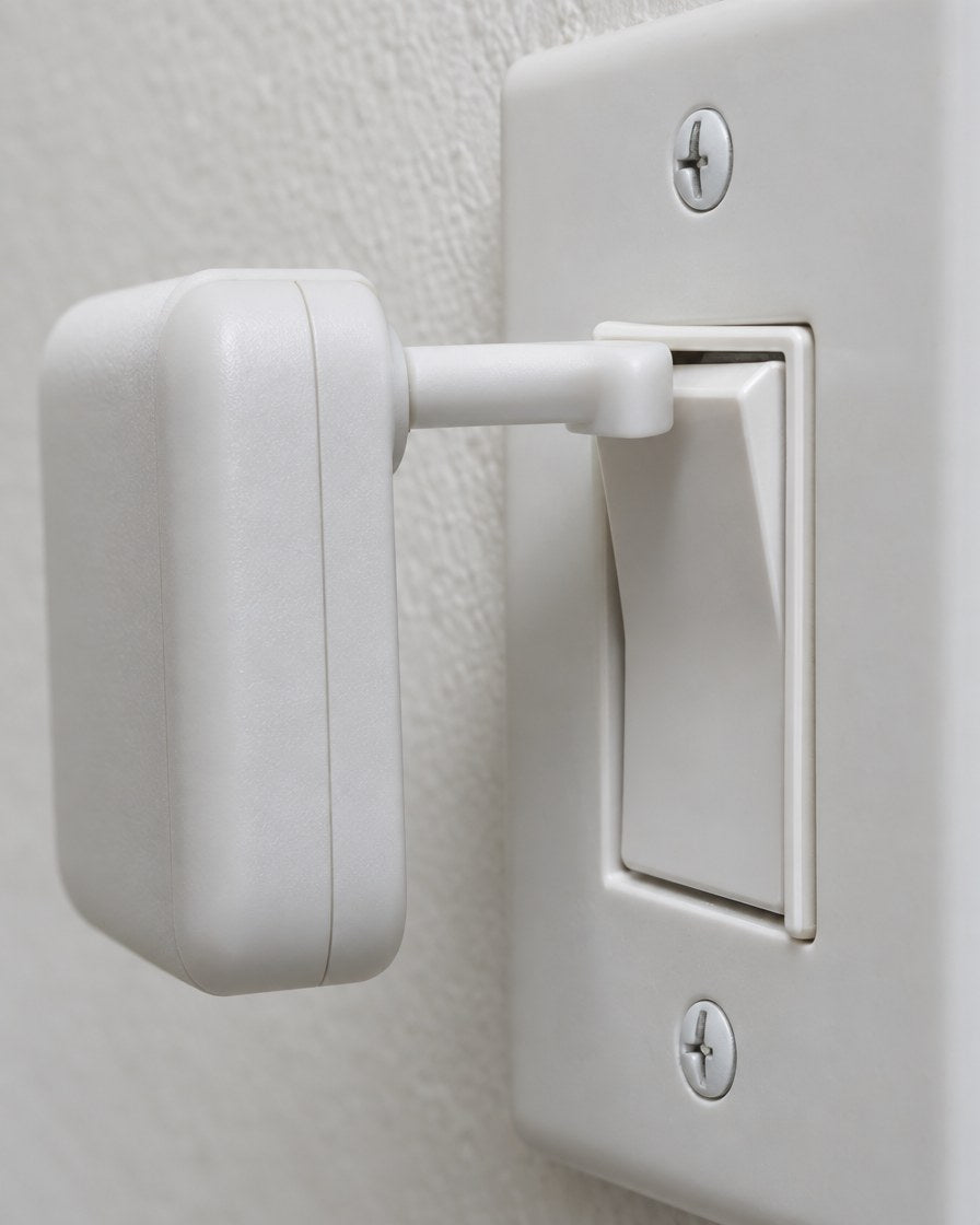 Close-up of the Bedswitch arm pressing a rocker switch